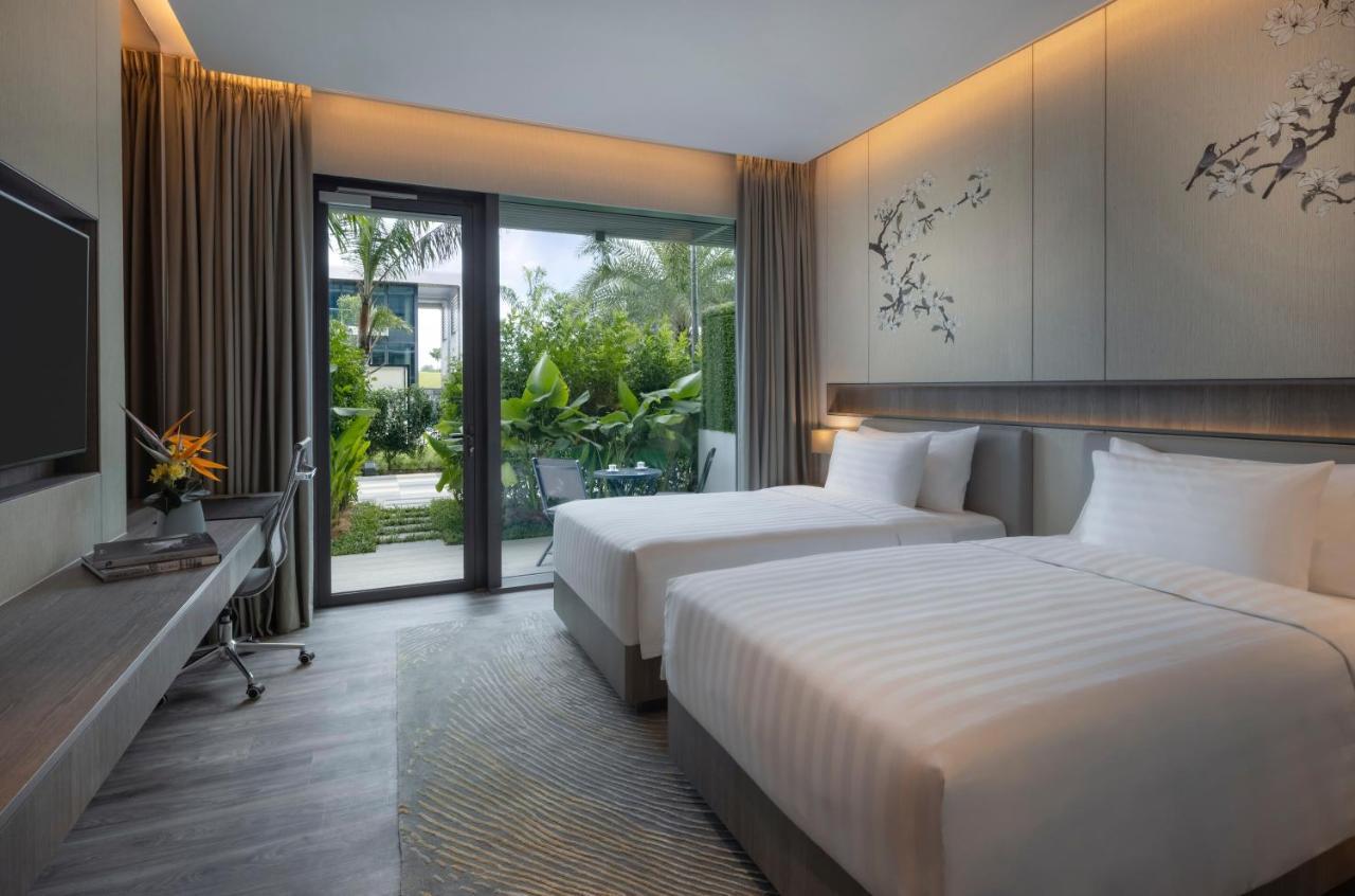 Deluxe Zweibettzimmer Laguna mit Patio und Poolblick