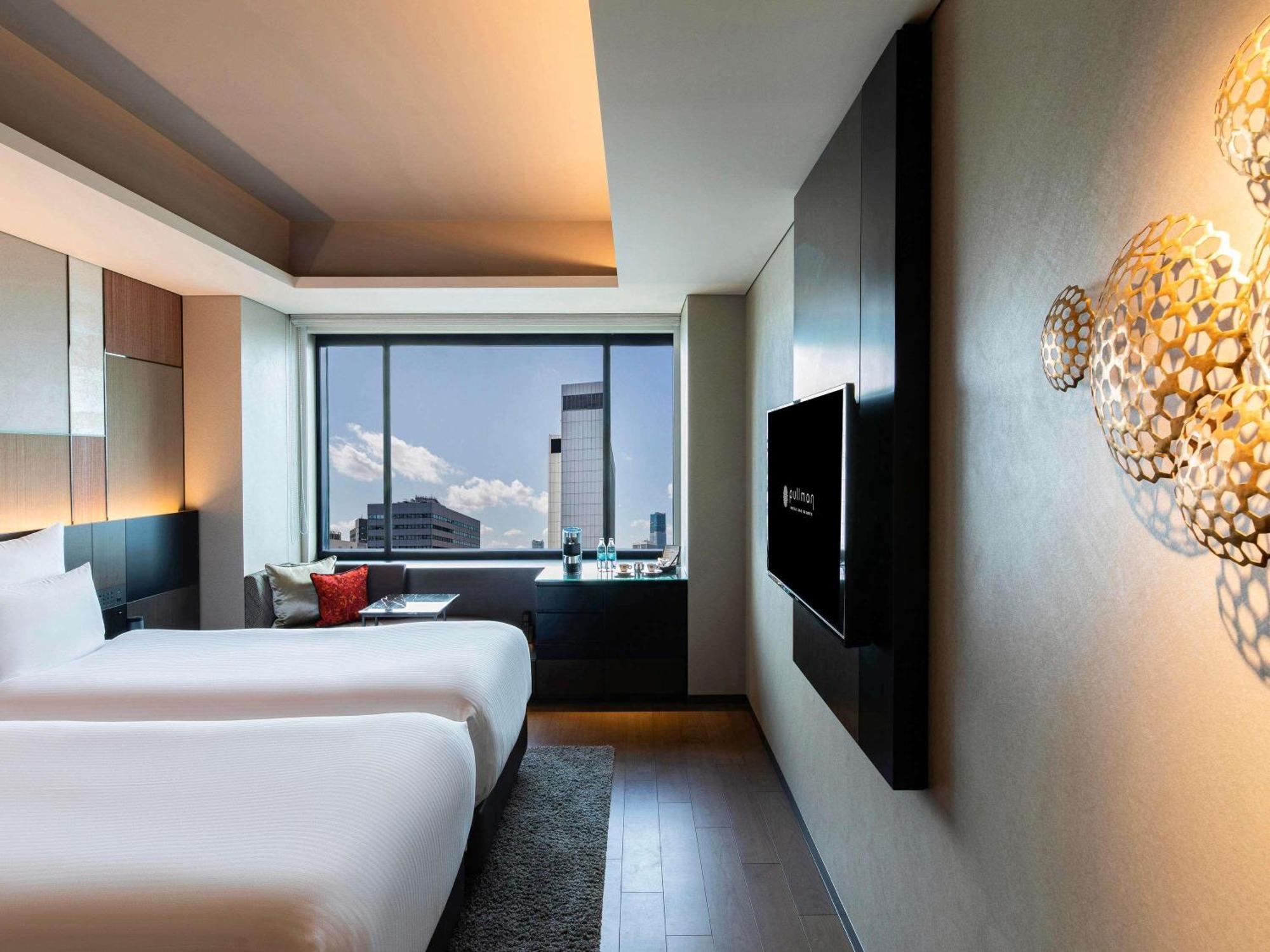 Chambre Lits Jumeaux de Luxe Exécutive - Accès au Salon
